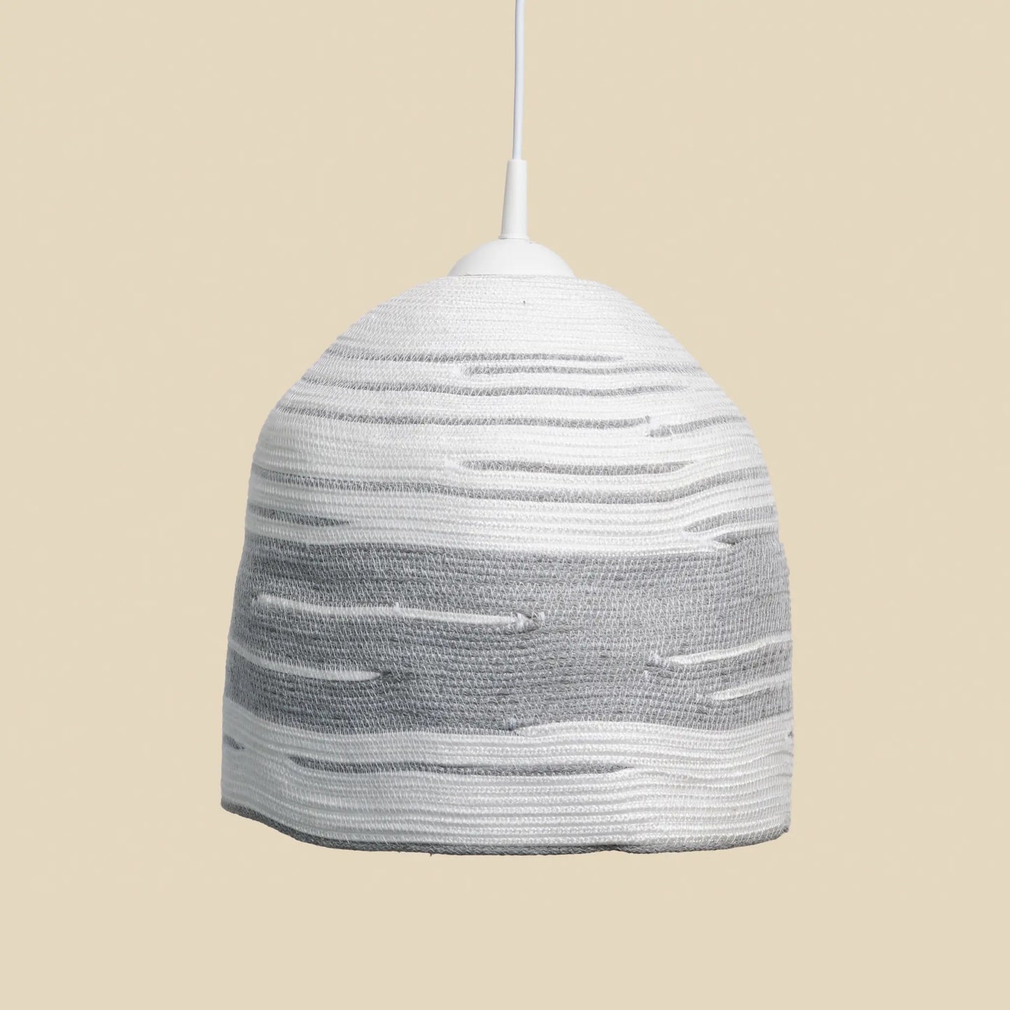 Large circular Halo chandelier made from cotton rope. It is white with grey details.