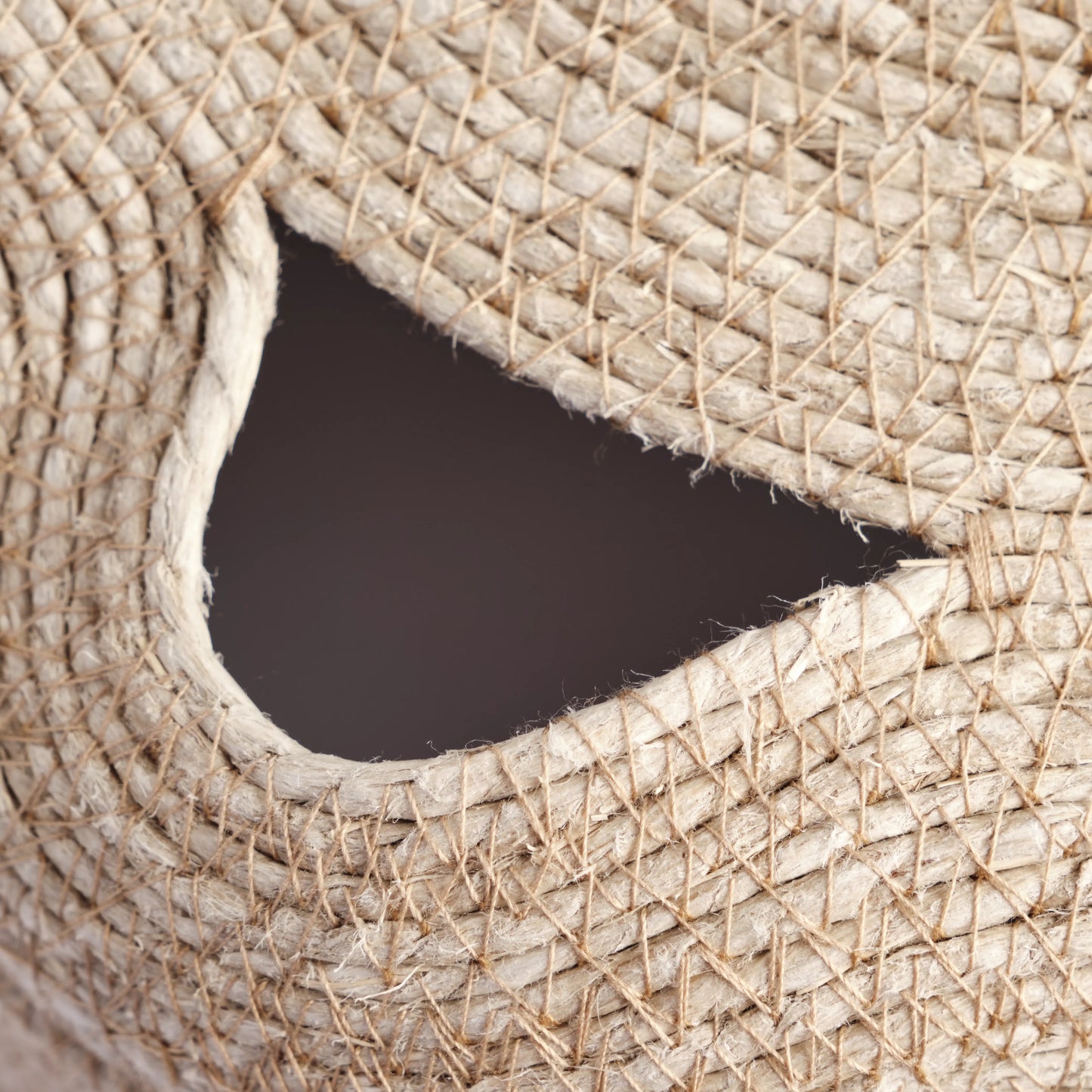 Large chandelier handmade from jute rope. It is the natural colour of jute. The image is a detail.