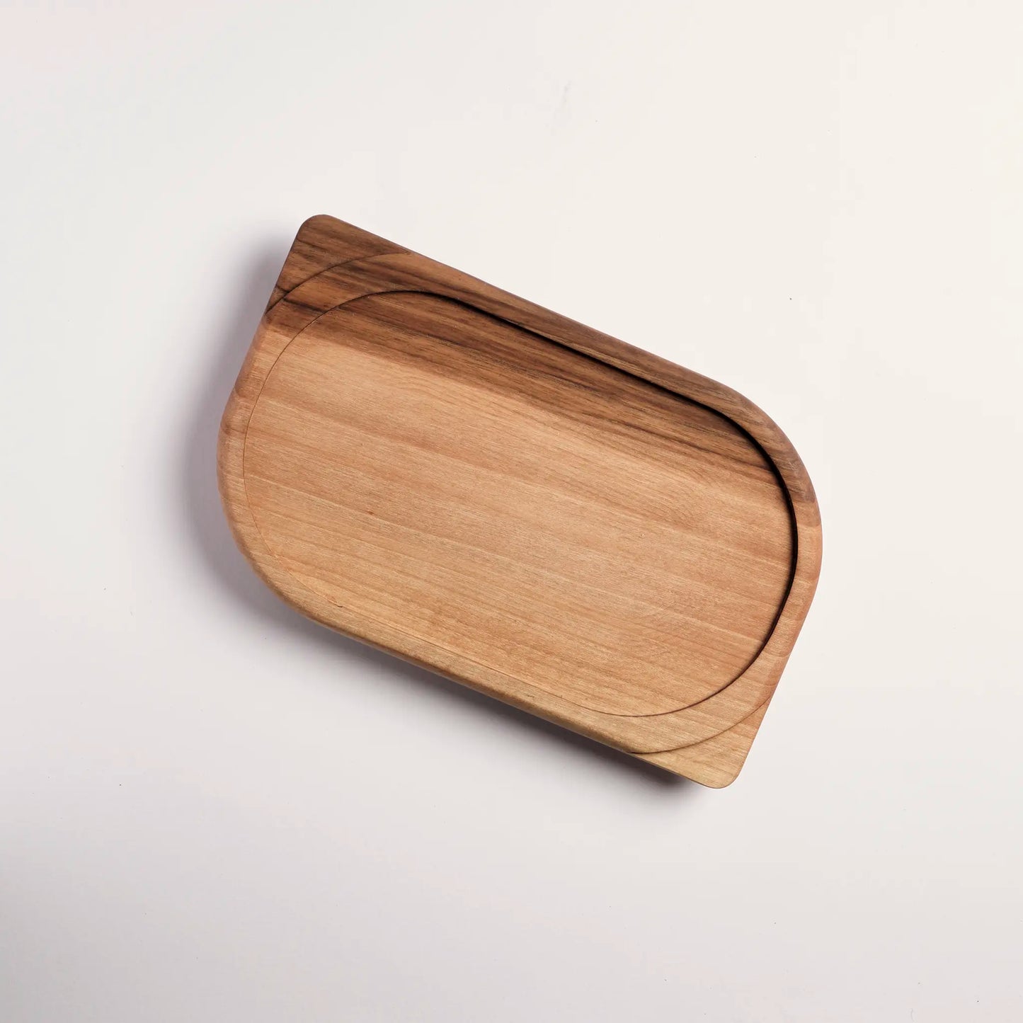 Timber tray made from a single piece of walnut wood