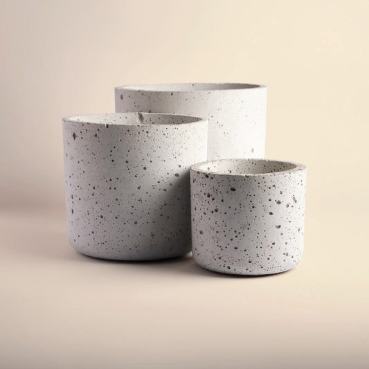 Three plant pots handmade from concrete, large, medium and small. 