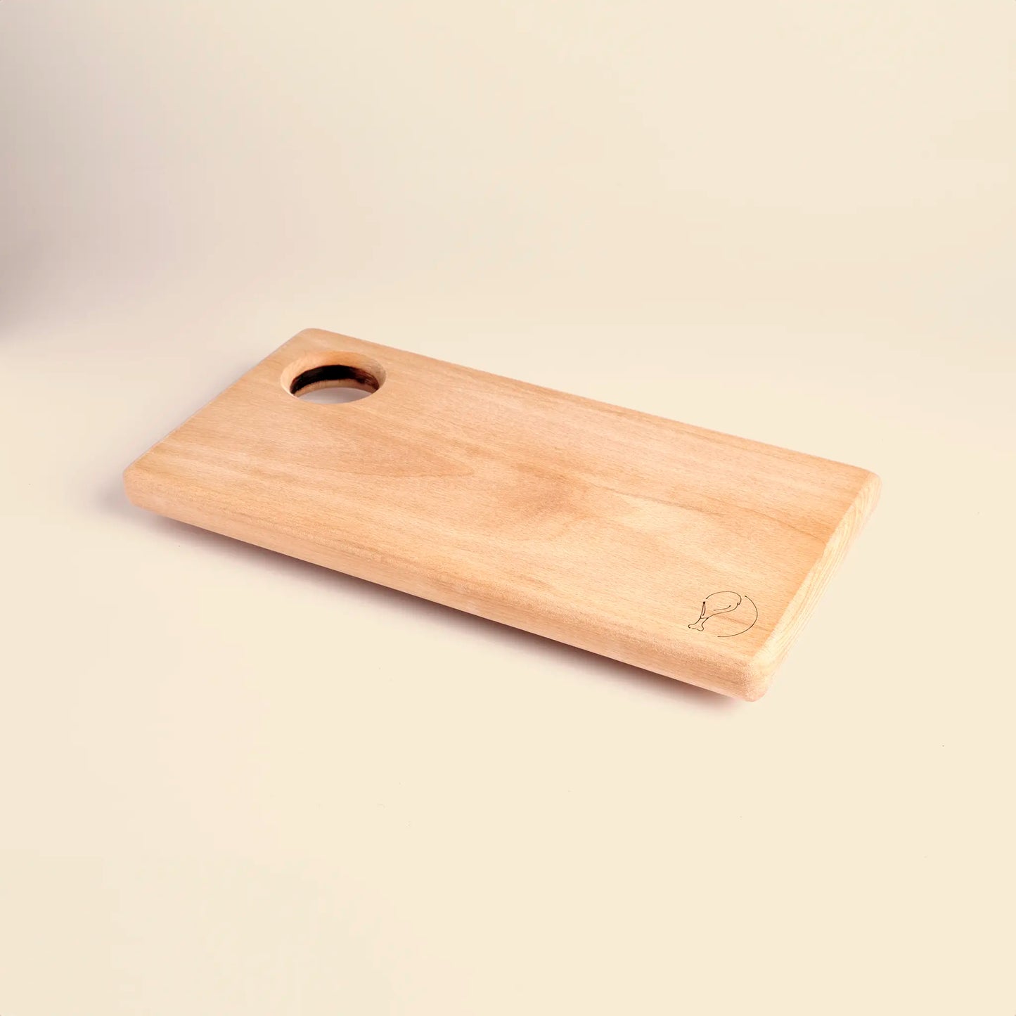 Cutting board handmade from beech wood with carved image of a piece of meat. 