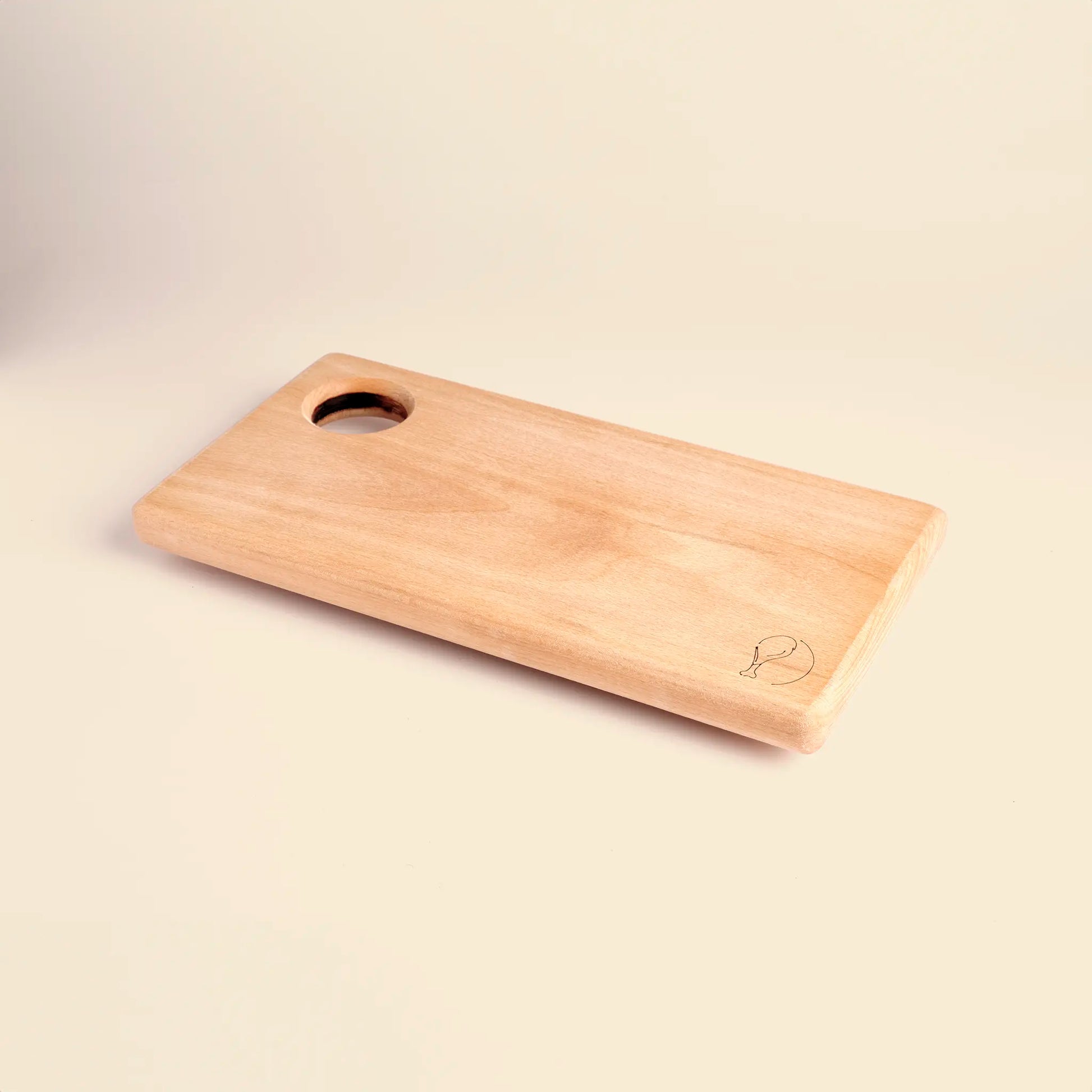 Cutting board handmade from beech wood with carved image of a piece of meat. 