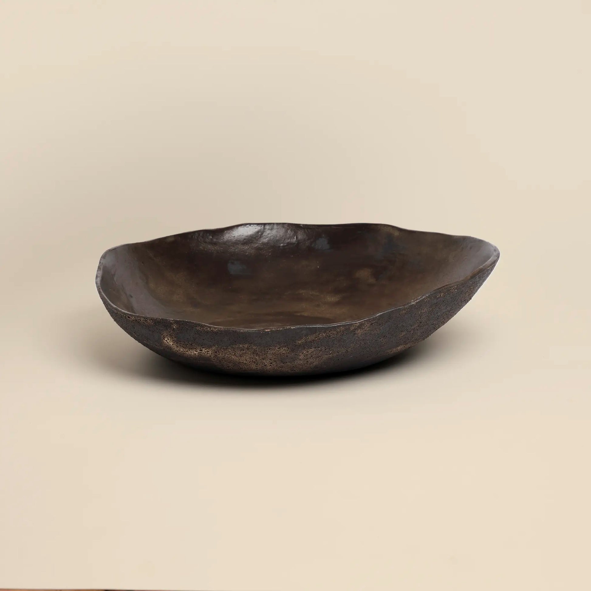 Magma flow ceramics bowl is made from black ceramics and has a unique shape.