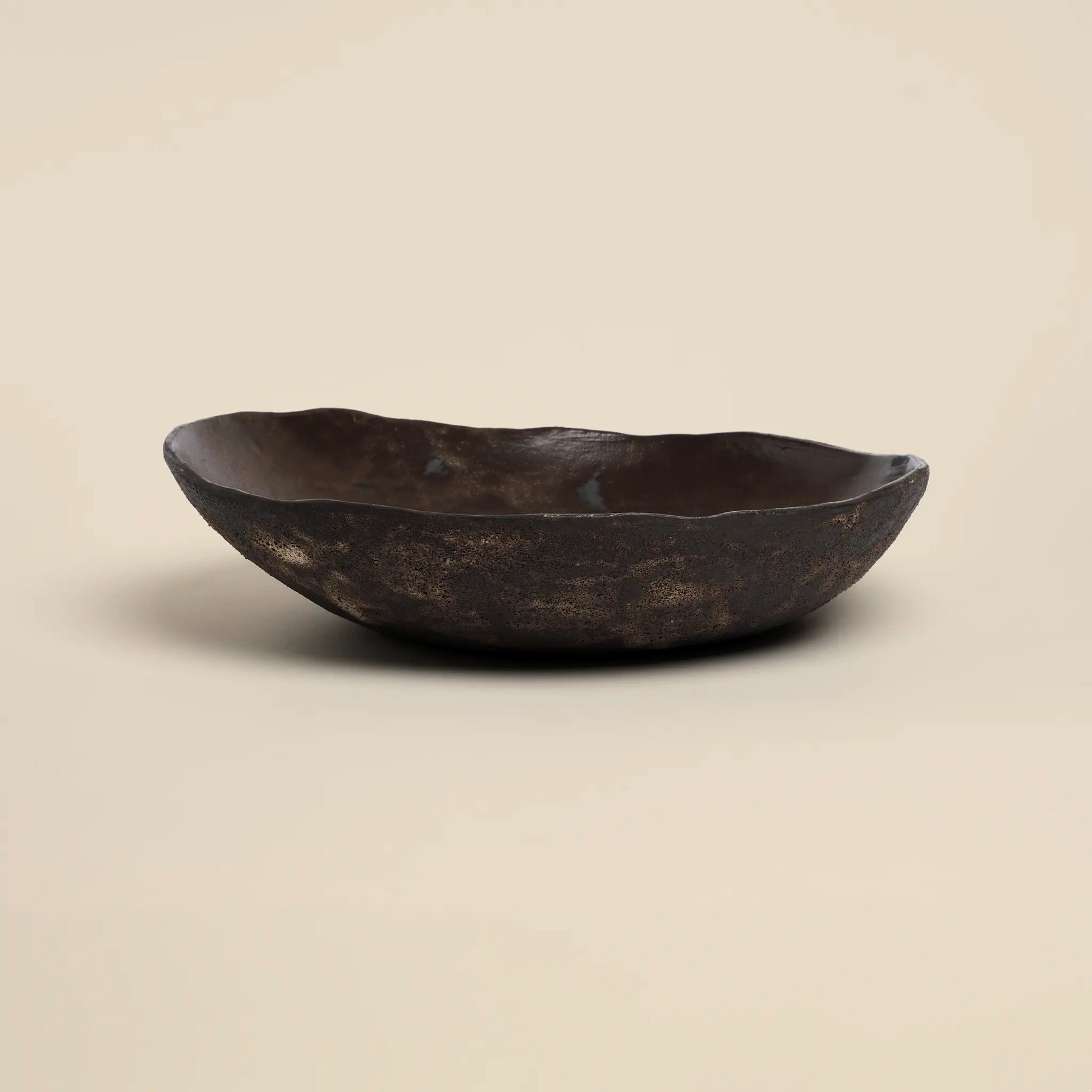 Magma flow ceramics bowl is made from black ceramics and has a unique shape.