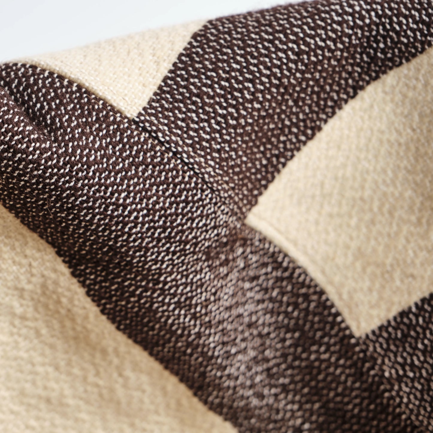 Homeware basket handmade from wool and cotton. The image is a detail of the basket. 