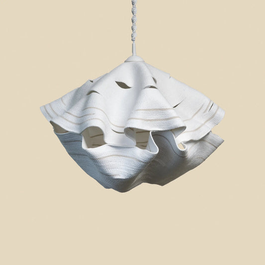 Large chandelier handmade from cotton rope. It is white with beige details and decorative hanging rope.  