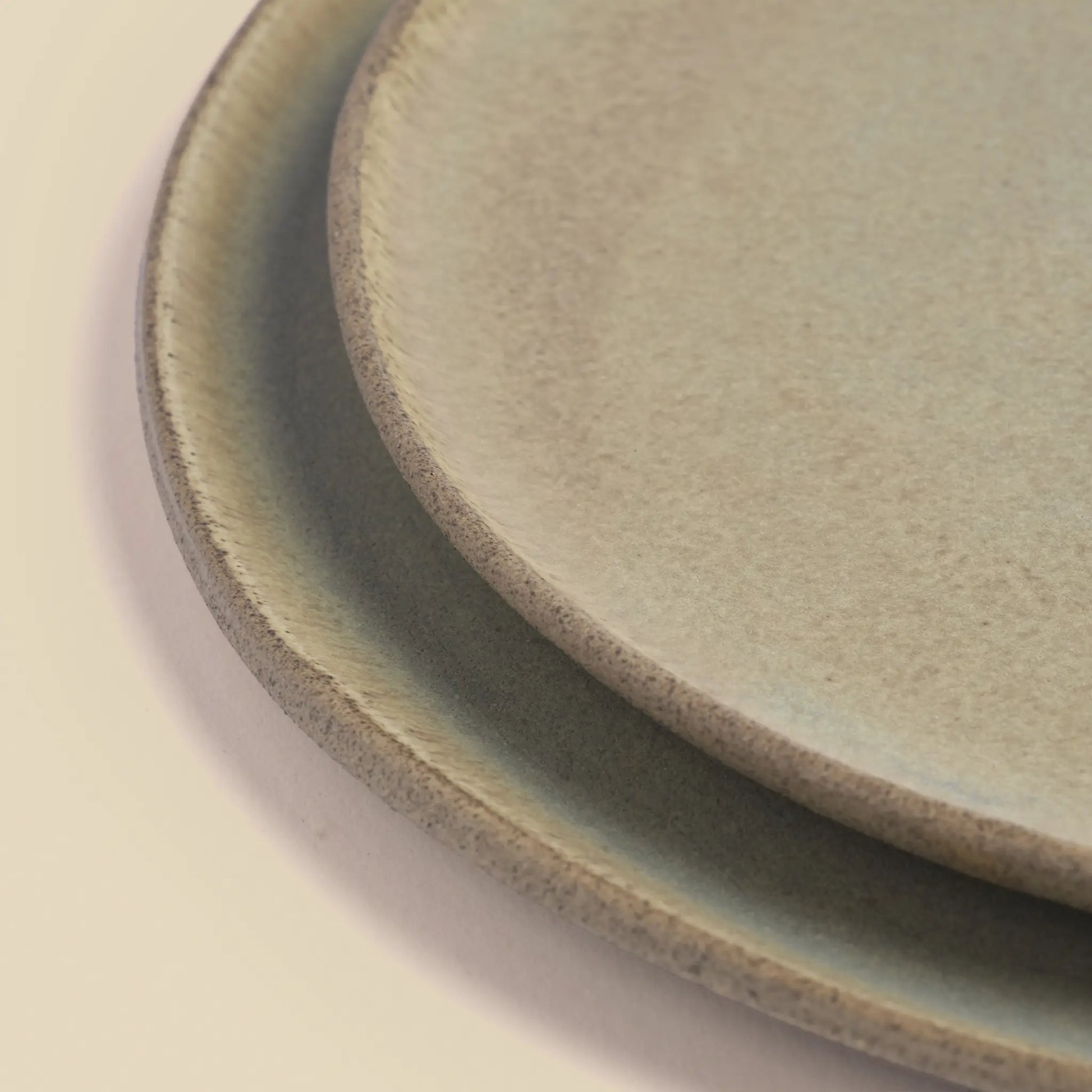 Stone Echo lunch set for two handmade from beige and green clay, big and small plates.