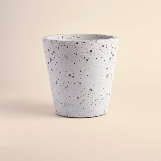 Medium plant pot handmade from concrete. It is  a cone shape with with decorative circular dents.